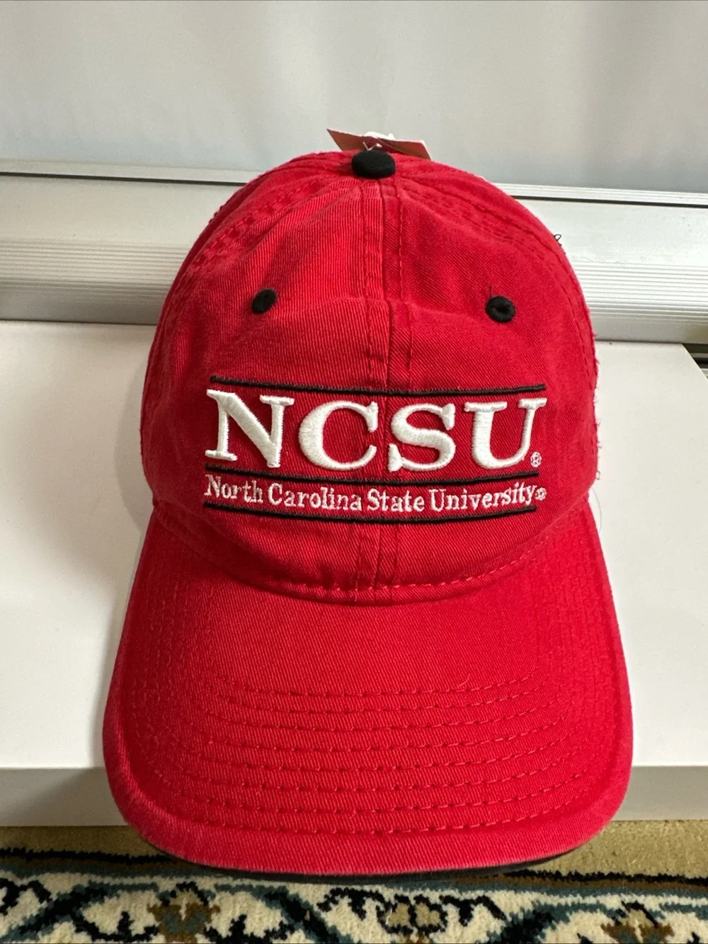 The Game Red Baseball Cap with White Embroidered Patch North Carolina State